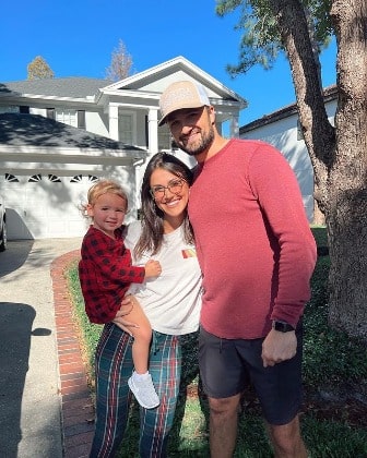 Kat wearing white T-shirt and mixed purple red pant. 